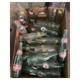 Vintage soda bottles including Dr Pepper, tab and
