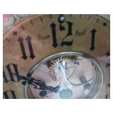 Appears to be a vintage German wall hanging clock