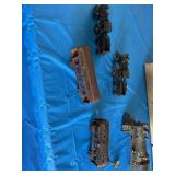 Antique cast-iron train toys. All appear to need