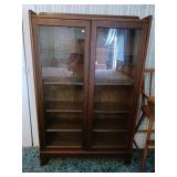 Antique glass cabinet with five shelves