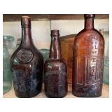 Three antique/vintage amber/brown bottles