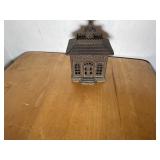 Cast iron Bank stands 6 inches tall and is 4