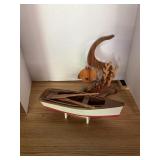 Wood carving. Boat and fish/coral reef.