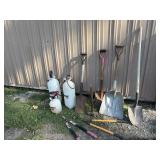 Shovels, sprayers, pruners, sledgehammer, and
