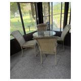 Round glass topped patio table, and four chair