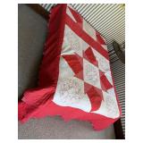 Old quilt shown on full-size bed. Has a few tears