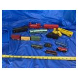 Metal train car, plastic train cars, and one