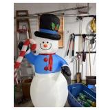 Inflatable Frosty the Snowman and yard lights