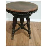 Piano stool. Appears to be an antique adjustable
