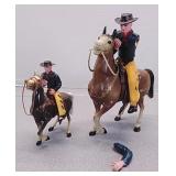 Plastic toy cowboys and horses