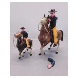 Plastic toy cowboys and horses