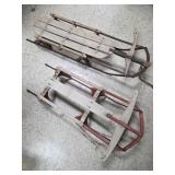 2 sleds vintage steel rail 39" & 45" long