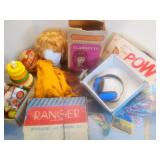 Assorted toys stacking rings, balls, wig, trinkets