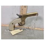 Double barrel black powder derringer brass frame.