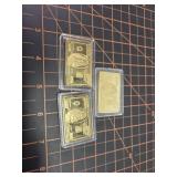 3 gold colored bars 100 bill design