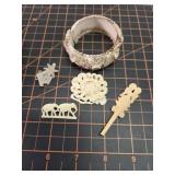 Carved pieces of jewelry