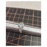 Blue stone and silver colored ring