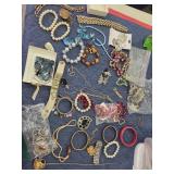 Jewelry lot, hat pin, Taurus necklace, and more