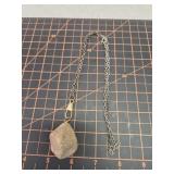 Necklace with large unknown stone, secret