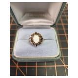 Opal and sapphire size 7 ring set in 10kt yellow