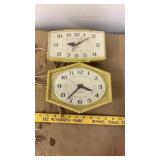 2 vintage General Electric electric wall clocks,
