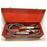 Hydraulic portable power kit in red metal box -
