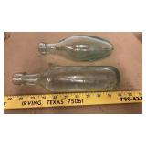 2 antique glass bottles, one is a torpedo, other