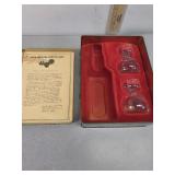 Jack Daniels tin and sampling glasses