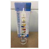 Galileo thermometer, measures 7 in tall, appears