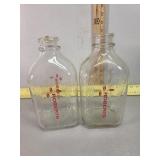 2 Robberts half gallon milk bottles