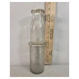 Robberts embossed glass milk bottle and cottage