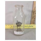 Quality dairy Fremont NE, quart, glass color