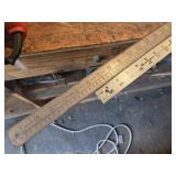 Double sided metal measuring sticks