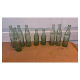 9 glass coke bottles