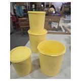 Yellow Tupperware canisters