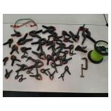 Clamps weed trimmer line +