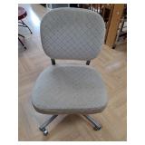 > Neutral upholstered office chair