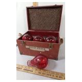 Vintage Red Comet glass fire grenades in wooden