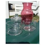 Rose colored vase & 3 glass storage containers
