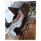 Baby buggy, porcelain doll, quilt