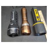Three battery operated flashlights