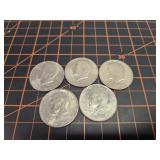 5 Kennedy half dollars