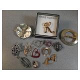 * brooches