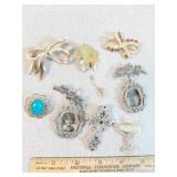 * brooches