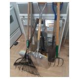 > Yard tools: pitchfork,  spade, rake, loppers +