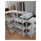 >several adjustable white plastic shelves.