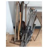>Yard tools: axe, rake, hole spade, folding chairs