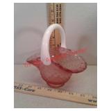 Pink glass basket with white handle