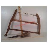 Vintage bow saw and fireplace ash shovel