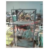 > Metal shelving unit and garden decor